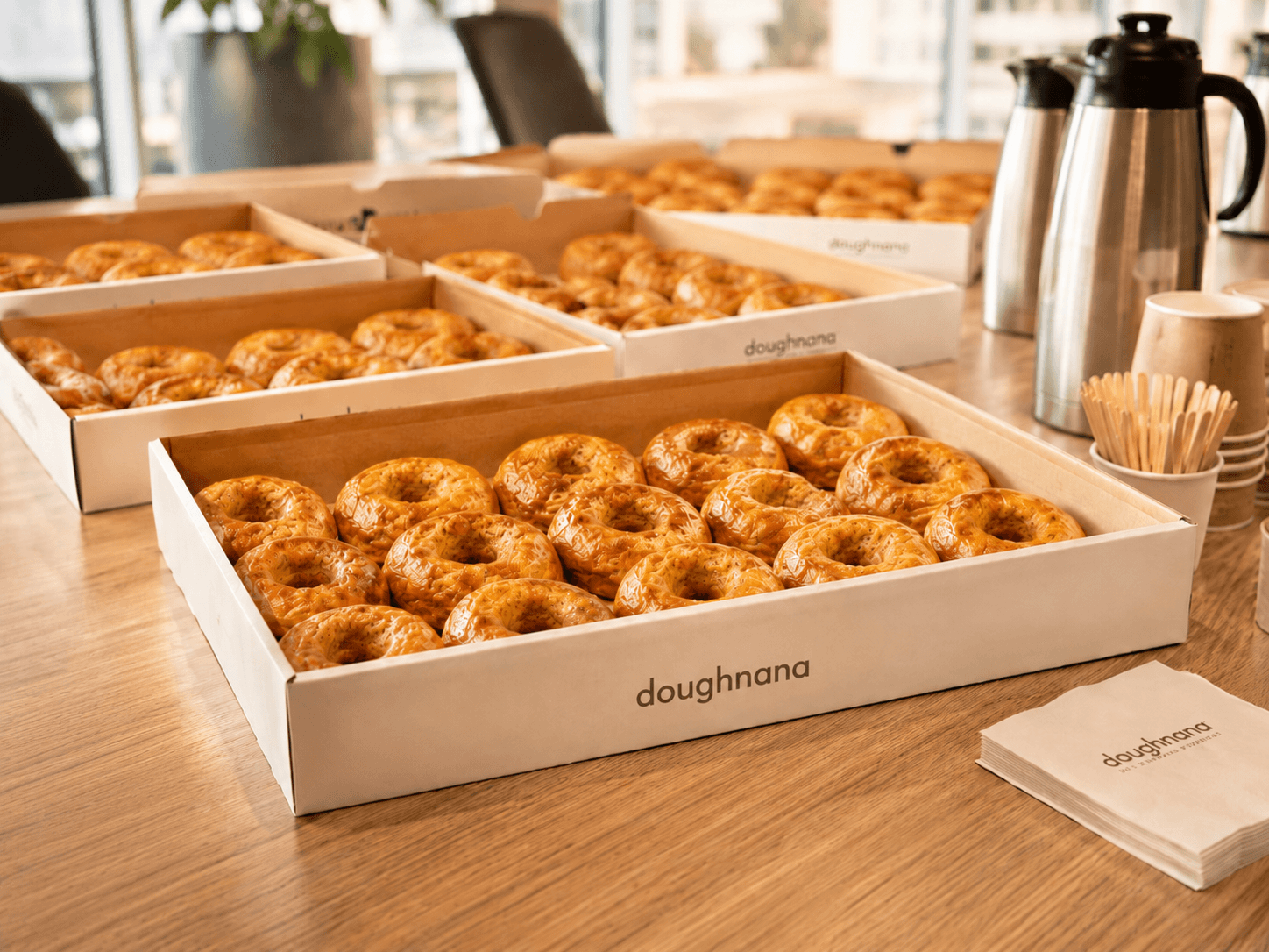 Large batch Doughnana order prepared for cafes, offices, and events